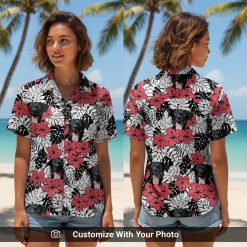 Woman wearing red Hawaiian shirt with black dog face and yellow hibiscus flowers