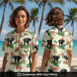 Woman wearing custom yellow Hawaiian shirt with black dog face, red hibiscus, and green leaves
