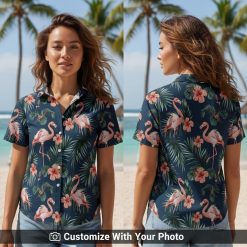 Woman in navy flamingo Hawaiian shirt with pink, green print at beach party