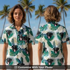 Woman wearing a green and white Hawaiian shirt with black dog, leafy beach pattern