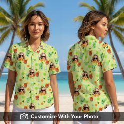 Woman wearing green Hawaiian shirt with custom face, cocktails, citrus and leaves design