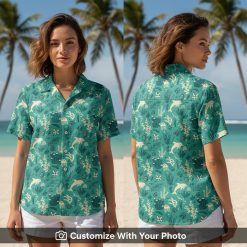 Woman in teal and yellow Hawaiian shirt with dolphins, coral, and sea life details