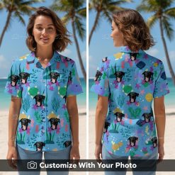 Woman wears Hawaiian Spongebob shirt with black dog face and tropical sea motifs