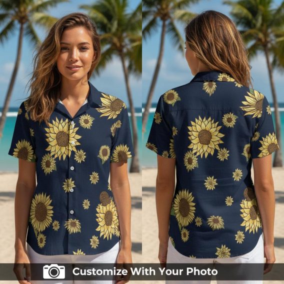 Woman wearing sunflower Hawaiian shirt with bright yellow flowers on dark blue fabric