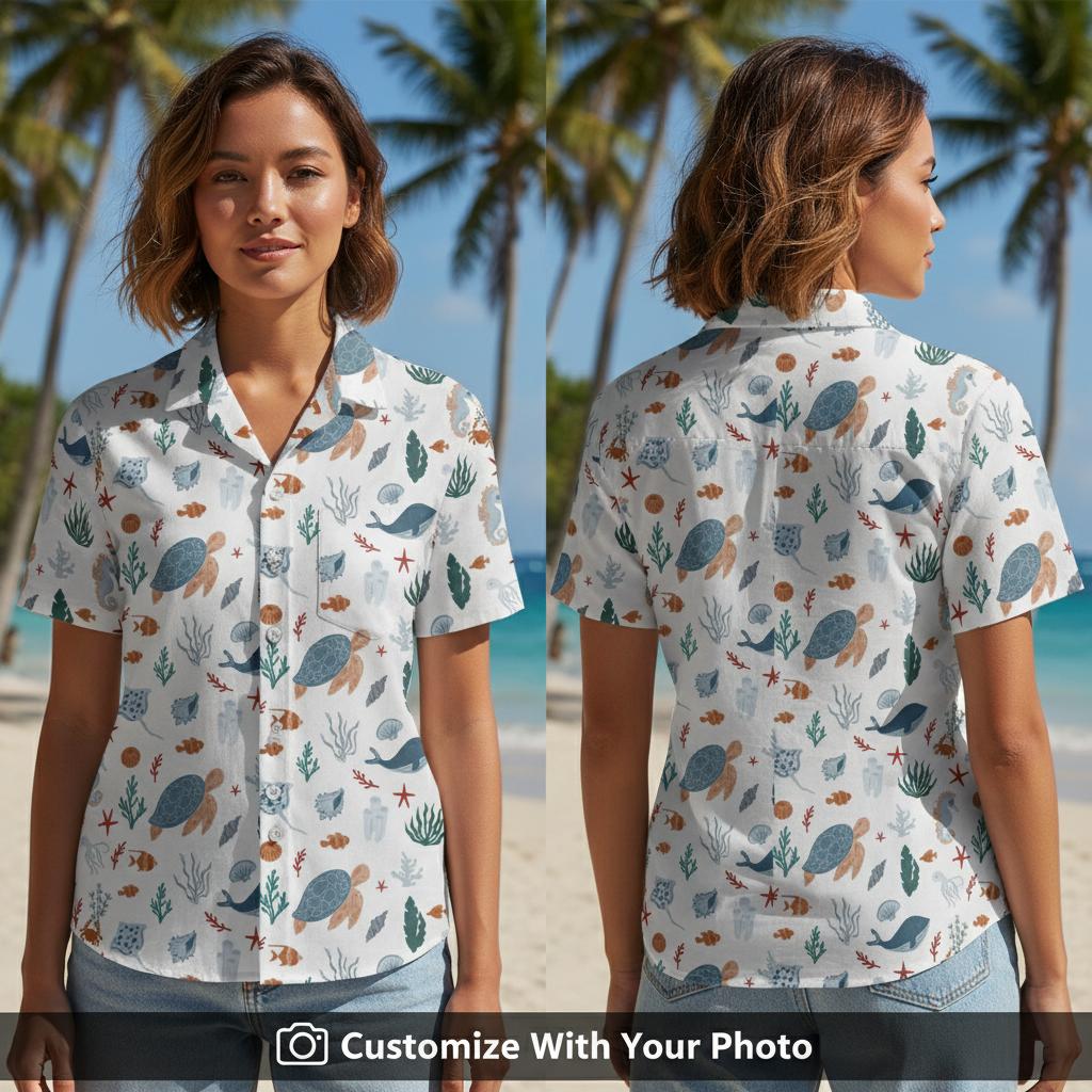 Woman wearing trendy fishing Hawaiian shirt with sea turtles and teal marine patterns