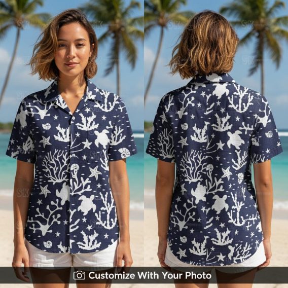 Woman wearing tropical ocean shirt with turtle, coral and starfish pattern on the beach