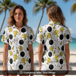 Woman wearing a fun white bowling Hawaiian shirt with pins, balls, trophies, and red stars pattern