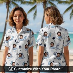 Woman in white Hawaiian shirt with cartoon dinosaurs, surfboards, palm trees, and blue accents.