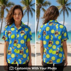 Woman wearing blue tropical shirt with citrus, sunglasses face, and cocktail print