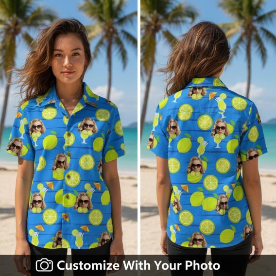 Woman wearing blue tropical shirt with citrus, sunglasses face, and cocktail print