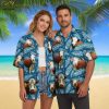Man in casual setting wearing mens cow print shirt Aloha style with shorts and sandals