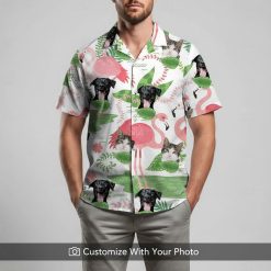 Man in tropical cat aloha shirt with dogs, cats, and large green leaf patterns