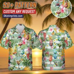 Man wearing cocktail print Hawaiian shirt at beach party setting with tropical drinks pattern