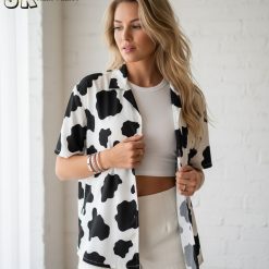 Specs infographic showing cowprint shirt Aloha style sizing chart and fabric details