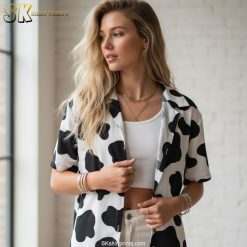 Size chart infographic showing cowprint Hawaiian shirt measurements, fabric specifications, and feature callouts