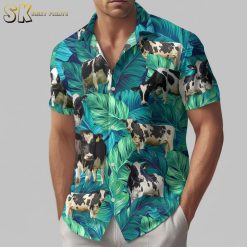 Cow print shirts with tropical Hawaiian design featuring cows and green foliage on blue fabric