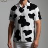 Male model poses in cow print t shirt Aloha style summer outdoor scene