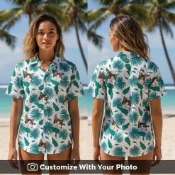 Woman wears custom cat Hawaiian shirt with teal palm leaf design on tropical vacation