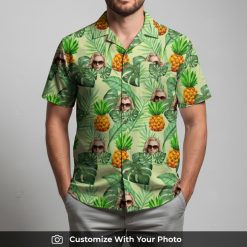 Man in vibrant custom face Hawaiian shirt featuring sunglasses, pineapples, and leaves