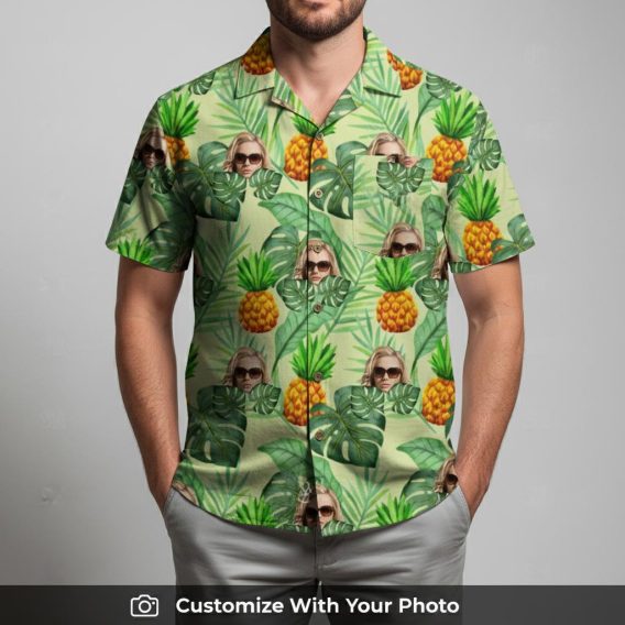 Man in vibrant custom face Hawaiian shirt featuring sunglasses, pineapples, and leaves