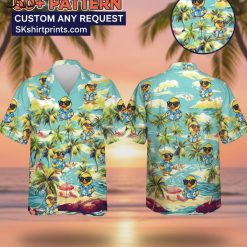 Male model wearing duck pattern Hawaiian shirt in casual lifestyle setting with tropical background