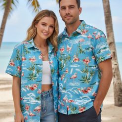 Model wearing pink flamingo aloha shirt displaying tropical bird pattern design