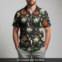 Man wearing funny custom cat Hawaiian shirt with spooky pumpkins and skulls design