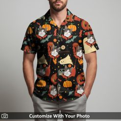 Man in funny spooky Hawaiian shirt with cat, pumpkins, bats, and ghosts print