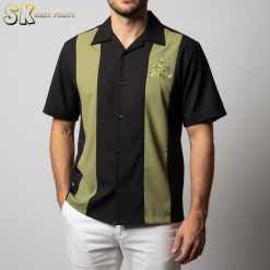 Hawaiian bowling shirt displayed on model showing tiki totem pattern and button-front design