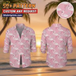 Male model wearing custom face print Hawaiian shirt with pink flamingo pattern in lifestyle setting