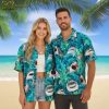 Model wearing Hawaiian shirt with sharks pattern in outdoor summer setting