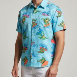 Person in turtle print Hawaiian shirt paired with turtleneck in relaxed lifestyle photo
