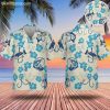 Hawaiian shirt with fish featuring blue hibiscus flowers and fishing hook design on light background
