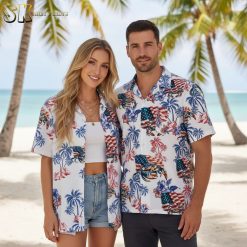Male wearing patriotic themed Aloha shirt with flag motifs in relaxed summer outfit styled for holiday celebrations