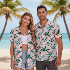 Woman styling Hawaiian shirt with denim shorts in casual everyday outfit against neutral backdrop