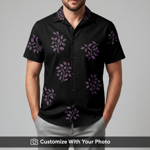 Man in classic black Hawaiian shirt with purple stylized leaf design, looking relaxed