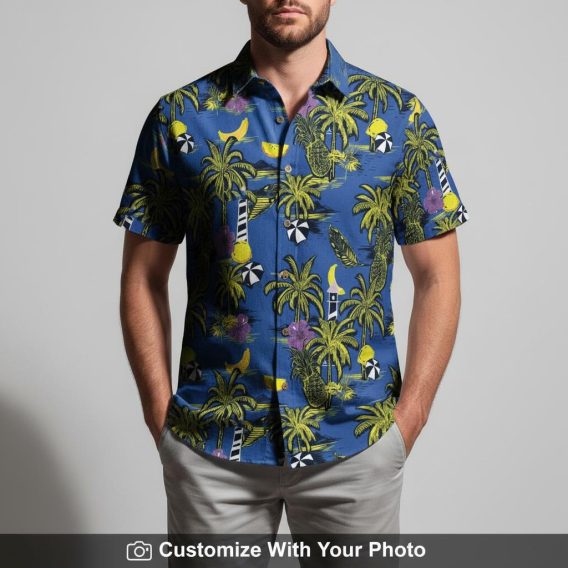 Man modeling blue Hawaiian shirt featuring palm tree, pineapple, and hibiscus motifs