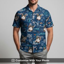 Man modeling blue Christmas Hawaiian shirt with cats, sunglasses, and palm trees