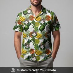 Man in fun cat face Hawaiian shirt decorated with pineapples, bananas, and leaves