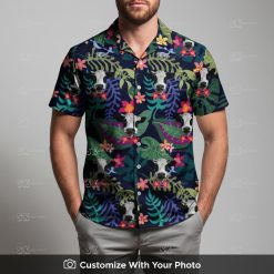 Man in cow print Hawaiian shirt featuring bold tropical leaves and vivid accents