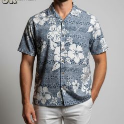 Man in cooke design Hawaiian shirt relaxing in tropical vacation setting with palm trees