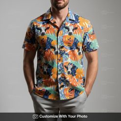Man in vibrant cow print Hawaiian shirt with blue, green, and orange tropical patterns