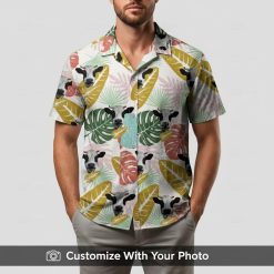 Man in cow print Hawaiian shirt featuring large cows and lively green tropical foliage
