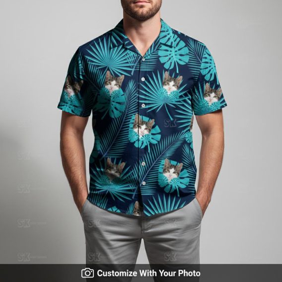 Man in custom cat Hawaiian shirt with dark blue base and tropical monstera leaves