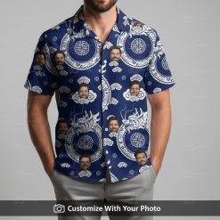 Man in a navy blue Hawaiian shirt with a unique dragon and circular face pattern