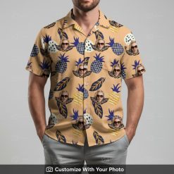 Man in custom face Hawaiian shirt with pineapple and leaf print on light beige fabric