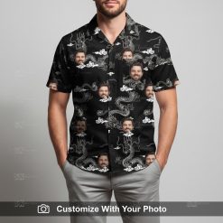 Man wearing custom black and white Hawaiian shirt with dragon and face motifs