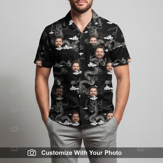Man wearing custom black and white Hawaiian shirt with dragon and face motifs