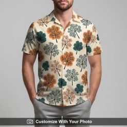 Man in a bold floral Hawaiian shirt featuring stylized orange and teal trees