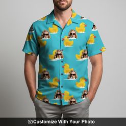Man wearing custom blue Hawaiian shirt with yellow rubber ducks and sunglasses faces